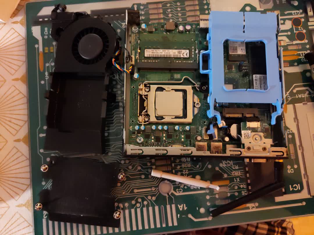 The inside of
    a dell optiplex 3050 micro is shown. One can make out the CPU