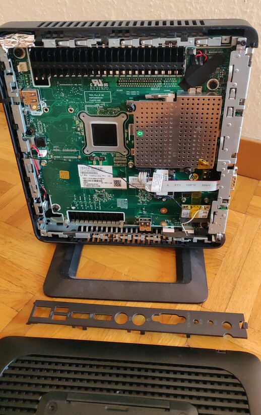 Picture of an HP t620 with the
		case opened, exposing the motherboard and various expansion slots.