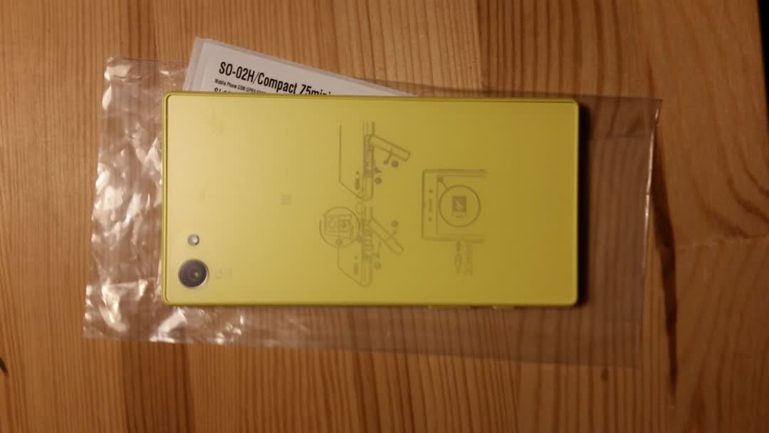 Picture of a Sony
		Xperia Z5 compact smartphone showing its yellow-coloured back.